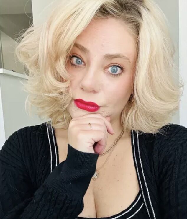 Woman shows her curls she made using a curling iron recommended in TikTok